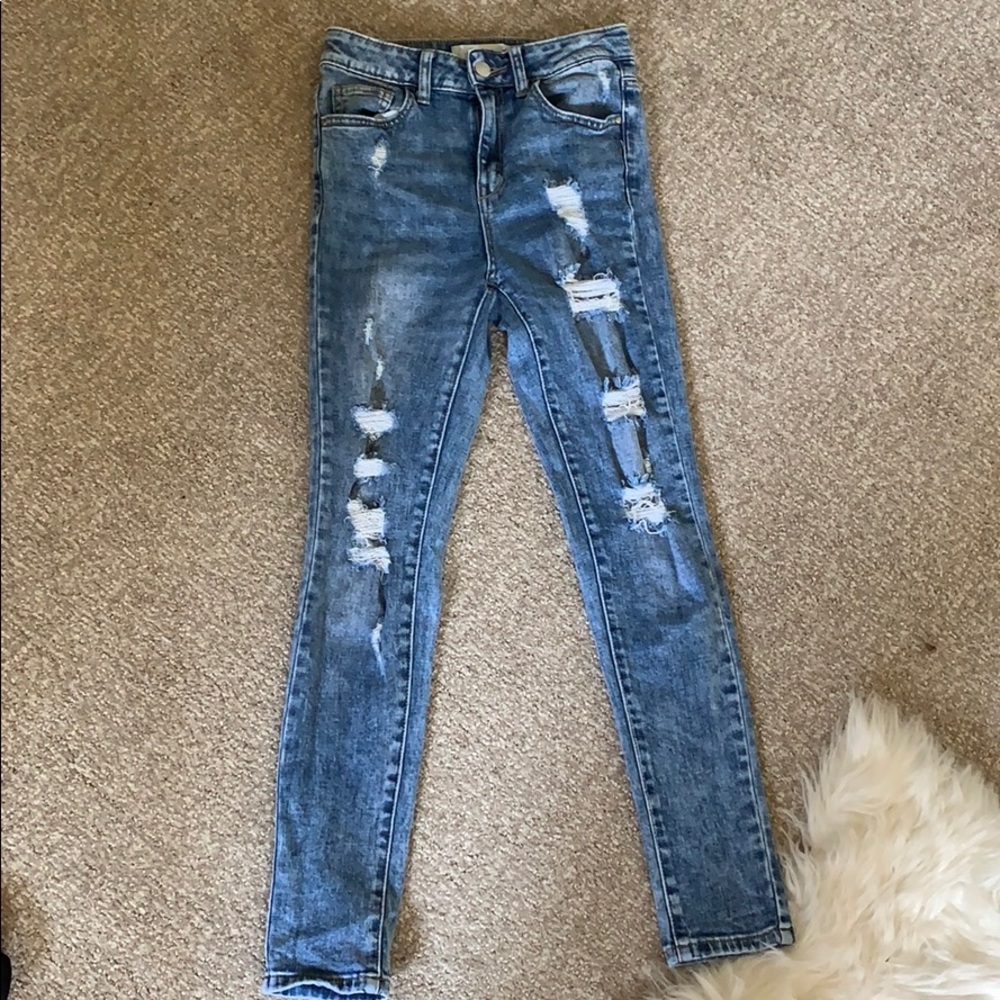 jeans, high wasted, and distressed.